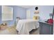 Light blue bedroom featuring a neutral-colored carpet, large window and decorated with toys and a fun theme at 101 Corvus Ct, Summerville, SC 29486