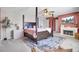 Primary bedroom with a four-poster bed, a fireplace, and a wall-mounted TV at 101 Corvus Ct, Summerville, SC 29486