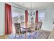 Dining room with backyard view from sliding glass door and stylish chandelier at 101 Corvus Ct, Summerville, SC 29486