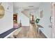 Bright entryway with hardwood floors, bench seating, and coat rack; open floor plan at 101 Corvus Ct, Summerville, SC 29486