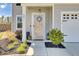 Inviting front entrance with a decorative wreath on the door and colorful landscaping at 101 Corvus Ct, Summerville, SC 29486