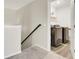 Hallway with carpet, showing the entrance to a laundry room with modern washer and dryer units at 101 Corvus Ct, Summerville, SC 29486
