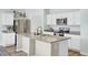 Kitchen island with stainless appliances, granite countertops, and ample storage at 101 Corvus Ct, Summerville, SC 29486