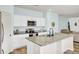 Bright kitchen with white cabinetry, granite countertops, and stainless steel appliances at 101 Corvus Ct, Summerville, SC 29486