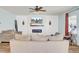 Comfortable living room with fireplace, ceiling fan, and serene decor at 101 Corvus Ct, Summerville, SC 29486