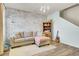 Inviting living area with a comfortable sofa, rustic bookshelf, and warm decor at 101 Corvus Ct, Summerville, SC 29486