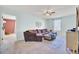 Comfortable living room with a plush sectional sofa, a ceiling fan, and an adjoining room at 101 Corvus Ct, Summerville, SC 29486