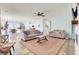 Spacious living room with two sofas, an area rug, and an open view to the kitchen at 101 Corvus Ct, Summerville, SC 29486