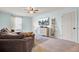 Inviting living room with a large sectional, a modern dresser, and a wall-mounted TV at 101 Corvus Ct, Summerville, SC 29486