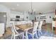Open concept dining area and living room with stylish decor and backyard view at 101 Corvus Ct, Summerville, SC 29486