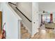 Carpeted staircase leading to a cozy living room with comfortable seating and a ceiling fan at 101 Corvus Ct, Summerville, SC 29486