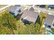 An aerial view of a property with a screened porch, patio, and manicured lawn at 1028 Harriman Ln, Charleston, SC 29492
