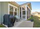 Relaxing screened-in back porch with patio furniture and a grill for outdoor living at 1028 Harriman Ln, Charleston, SC 29492