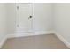 Unfinished basement area with door, neutral walls and carpet, ready for customization at 1028 Harriman Ln, Charleston, SC 29492