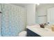 Bathroom featuring floral shower curtain, tile floor, and dark vanity with sink at 1028 Harriman Ln, Charleston, SC 29492