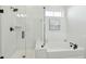 Beautiful bathroom featuring a tub and shower with white subway tile and modern fixtures at 1028 Harriman Ln, Charleston, SC 29492