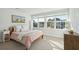 Bright bedroom featuring a large window, soft bedding, and stylish decor at 1028 Harriman Ln, Charleston, SC 29492