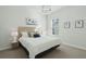 Cozy bedroom with neutral tones, a comfortable bed, and natural light from the window at 1028 Harriman Ln, Charleston, SC 29492