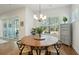 Dining area with a round table and a view of the backyard through sliding glass doors at 1028 Harriman Ln, Charleston, SC 29492