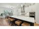 Bright, modern kitchen with white cabinets, stainless steel appliances, and a spacious island with seating at 1028 Harriman Ln, Charleston, SC 29492