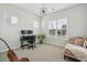 Bright office space featuring two windows, desk, chair, and comfortable lounge chair at 1028 Harriman Ln, Charleston, SC 29492