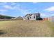 Wide backyard featuring healthy lawn, with a wooden privacy fence, a perfect place for families at 1144 Wading Point Blvd, Huger, SC 29450