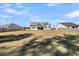 A beautifully maintained backyard with lush green lawn, bordered by a charming wooden privacy fence at 1144 Wading Point Blvd, Huger, SC 29450