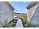 A view of a lake through the side yards of two neighboring single Gathering homes at 1144 Wading Point Blvd, Huger, SC 29450