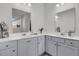 Bathroom featuring a double vanity with modern hardware, quartz countertops, and decorative accents at 1144 Wading Point Blvd, Huger, SC 29450