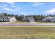 A single Gathering home with a grey exterior, attached garage, and green lawn at 1144 Wading Point Blvd, Huger, SC 29450