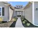 Inviting entryway with a walkway, manicured landscaping, and double front doors at 1144 Wading Point Blvd, Huger, SC 29450