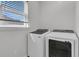 Modern laundry room with front-loading washer and dryer at 1144 Wading Point Blvd, Huger, SC 29450