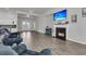 Cozy living room with a fireplace, large screen television, and comfortable seating at 1144 Wading Point Blvd, Huger, SC 29450