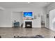 Living room featuring a fireplace, tv, an adjacent bedroom, and a sliding glass door at 1144 Wading Point Blvd, Huger, SC 29450