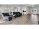 Open living space featuring recessed lighting, a gray sofa, and an adjacent kitchen and dining area at 1144 Wading Point Blvd, Huger, SC 29450