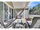 Covered patio with stainless steel grill and comfortable seating at 1144 Wading Point Blvd, Huger, SC 29450