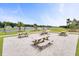 Charming picnic area with lake views, perfect for outdoor gatherings and relaxation at 1144 Wading Point Blvd, Huger, SC 29450