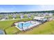 Community pool and amenity center with palm trees and plenty of seating in a beautiful neighborhood at 1144 Wading Point Blvd, Huger, SC 29450