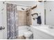 Well-lit bathroom with modern fixtures, shower, and stylish shelves for extra storage at 115 Tennyson Way, Summerville, SC 29486