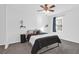 Cozy bedroom features a ceiling fan and large window, providing plenty of natural light at 115 Tennyson Way, Summerville, SC 29486