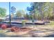 This fenced-in community playground has swings and a playground area surrounded by green space at 115 Tennyson Way, Summerville, SC 29486