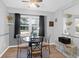 Bright dining area with wood floors, a ceiling fan, and a granite table, perfect for meals at 115 Tennyson Way, Summerville, SC 29486