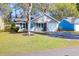Charming home with well-maintained lawn, blue accents, and ample parking at 115 Tennyson Way, Summerville, SC 29486