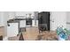 Well-lit kitchen features white cabinets, modern appliances, and beautiful vinyl flooring at 115 Tennyson Way, Summerville, SC 29486