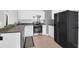 Functional kitchen with stainless steel appliances and white cabinets at 115 Tennyson Way, Summerville, SC 29486