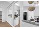 Open kitchen layout with white cabinetry and a black appliance package at 115 Tennyson Way, Summerville, SC 29486