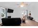 Comfortable living room with wood floors, contemporary decor, and plenty of natural light at 115 Tennyson Way, Summerville, SC 29486