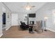 Bright living area with ample seating, a ceiling fan, and a mounted television at 115 Tennyson Way, Summerville, SC 29486