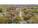 An aerial view of a tree-lined street with well-maintained homes and lush landscaping at 1162 South Shadow Dr, Mount Pleasant, SC 29464