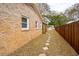 Backyard with a brick exterior, grass, and a stepping stone pathway at 1162 South Shadow Dr, Mount Pleasant, SC 29464